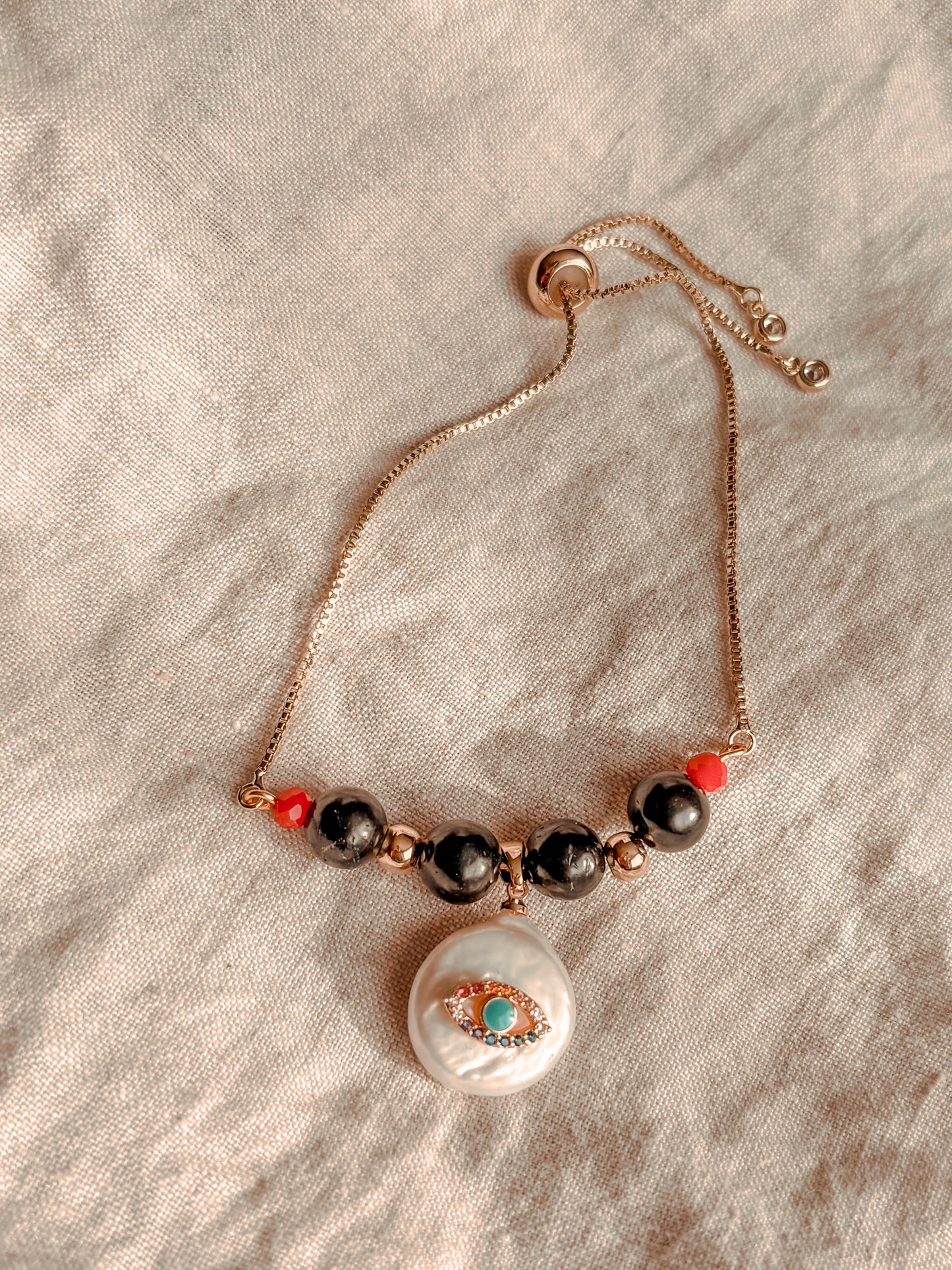 Pulsera Amuleto Ojo Turco Protector: Shunguita y Nácar Natural