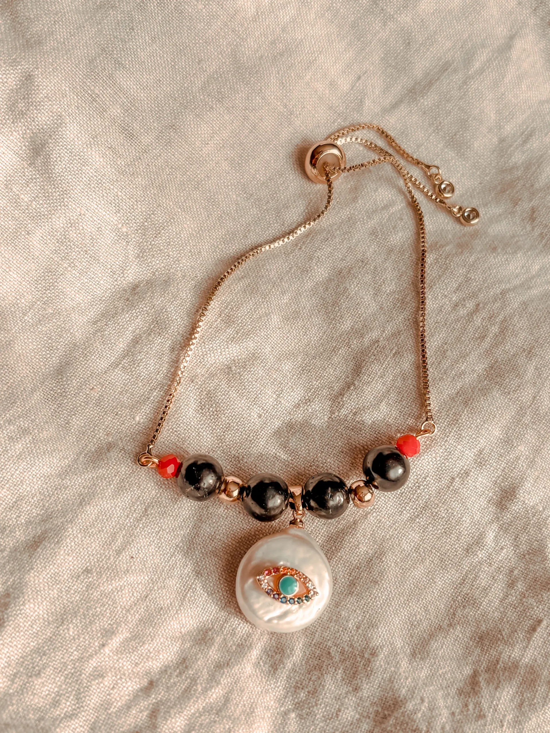 Pulsera Amuleto Ojo Turco Protector: Shunguita y Nácar Natural